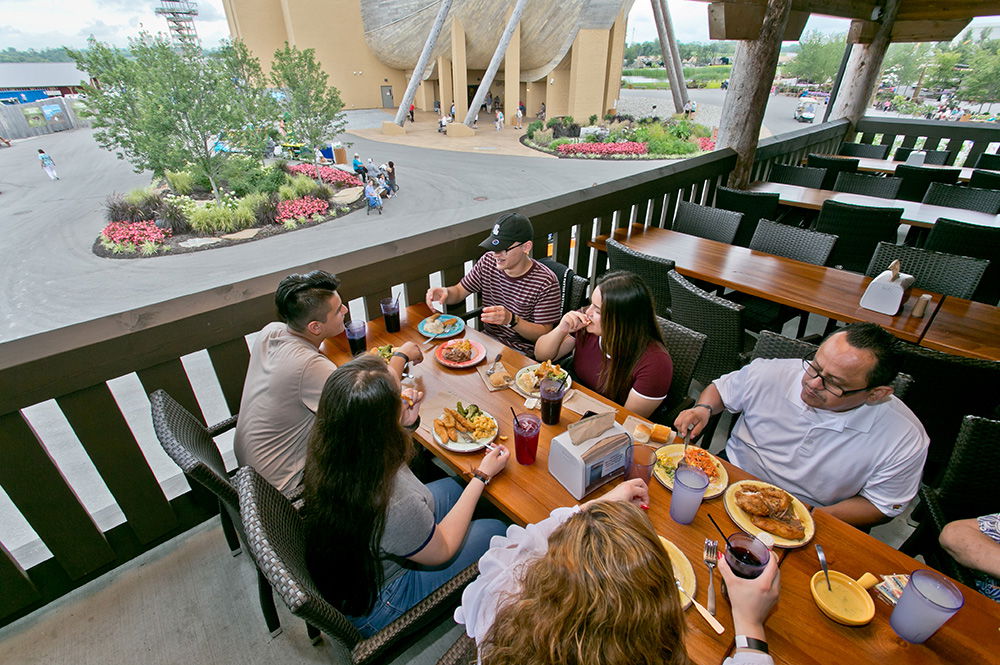 Family Eating Outside Emzara's Buffet