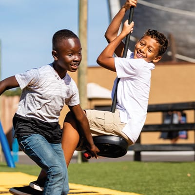 kids playing on playground outside ark