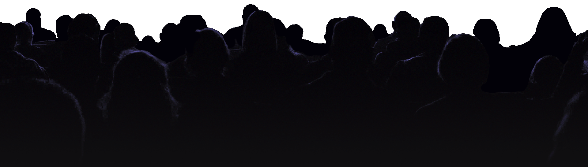 silhouette of audience raising hands
